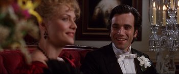 Movie still from “The Age of Innocence” (1993), directed by Martin Scorsese – A man and a woman sitting next to each other; Close Up shot, Over the shoulder angle