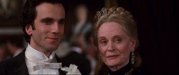 Movie still from “The Age of Innocence” (1993), directed by Martin Scorsese – An older woman and a younger man in formal wear; Close Up shot, Over the shoulder angle
