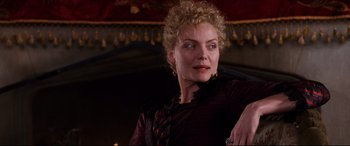 Movie still from “The Age of Innocence” (1993), directed by Martin Scorsese – A person wearing a dress; Close Up shot, Over the shoulder angle