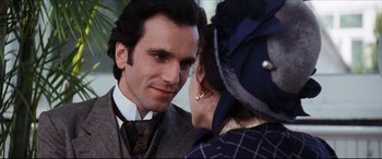 Movie still from “The Age of Innocence” (1993), directed by Martin Scorsese – A man and a woman talking to each other; Close Up shot, Over the shoulder angle