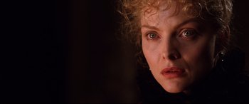 Movie still from “The Age of Innocence” (1993), directed by Martin Scorsese – A woman's face in the dark; Close Up shot, Over the shoulder angle