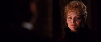 Movie still from “The Age of Innocence” (1993), directed by Martin Scorsese – A person with curly red hair; Close Up shot, Over the shoulder angle