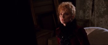 Movie still from “The Age of Innocence” (1993), directed by Martin Scorsese – A woman with red hair and a black scarf; Close Up shot, Over the shoulder angle