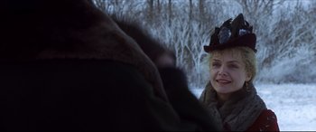 Movie still from “The Age of Innocence” (1993), directed by Martin Scorsese – An older woman wearing a hat and a fur coat; Close Up shot, Over the shoulder angle