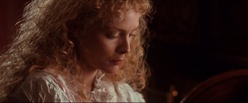 Movie still from “The Age of Innocence” (1993), directed by Martin Scorsese – A person with curly hair; Close Up shot, Low angle