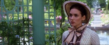 Movie still from “The Age of Innocence” (1993), directed by Martin Scorsese – A young woman in a hat and a dress; Close Up shot, Over the shoulder angle