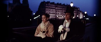 Movie still from “The Age of Innocence” (1993), directed by Martin Scorsese – A man and a woman sitting in a carriage at night; Medium shot, Low angle