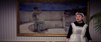 Movie still from “The Age of Innocence” (1993), directed by Martin Scorsese – A painting of a woman sitting on a stone bench; Wide shot, Low angle