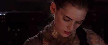 Movie still from “The Age of Innocence” (1993), directed by Martin Scorsese – A person wearing a necklace; Close Up shot, High angle