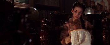 Movie still from “The Age of Innocence” (1993), directed by Martin Scorsese – A young woman in a victorian era dress; Medium shot, Over the shoulder angle
