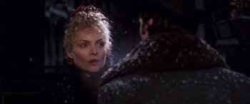 Movie still from “The Age of Innocence” (1993), directed by Martin Scorsese – A person wearing a black jacket; Close Up shot, Over the shoulder angle