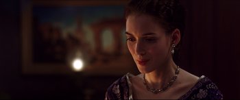 Movie still from “The Age of Innocence” (1993), directed by Martin Scorsese – A person wearing a necklace; Close Up shot, Over the shoulder angle