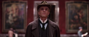 Movie still from “The Age of Innocence” (1993), directed by Martin Scorsese – A man wearing a hat and a suit and tie; Close Up shot, Low angle