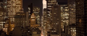 Movie still from “The Big Short” (2015), directed by Adam McKay – A view of a city skyline at night time; Extreme Wide shot, High angle