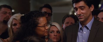 Movie still from “The Big Short” (2015), directed by Adam McKay – A group of people standing next to each other in a room; Close Up shot, Over the shoulder angle