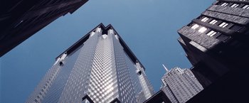 Movie still from “The Big Short” (2015), directed by Adam McKay – Looking up at a skyscraper in a city; Extreme Wide shot, Low angle