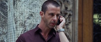 Movie still from “The Big Short” (2015), directed by Adam McKay – A person talking on a cell phone; Close Up shot, Low angle