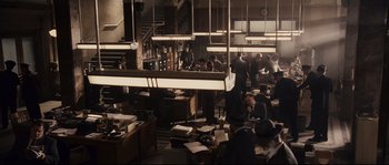 Movie still from “The Black Dahlia” (2006), directed by Brian De Palma – A group of people sitting at a table in a room; Extreme Wide shot, High angle