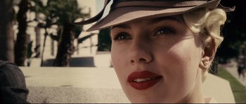 Movie still from “The Black Dahlia” (2006), directed by Brian De Palma – A woman wearing a hat; Close Up shot, Over the shoulder angle