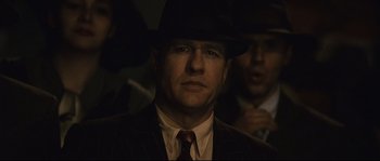Movie still from “The Black Dahlia” (2006), directed by Brian De Palma – A man wearing a suit and a hat; Close Up shot, Low angle