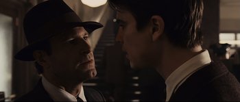 Movie still from “The Black Dahlia” (2006), directed by Brian De Palma – A man in a hat and a man in a suit looking at each other; Close Up shot, Over the shoulder angle