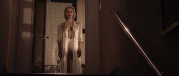Movie still from “The Black Dahlia” (2006), directed by Brian De Palma – A woman standing in front of a bathroom mirror; Medium shot, Low angle