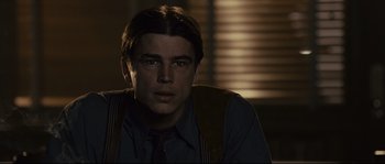 Movie still from “The Black Dahlia” (2006), directed by Brian De Palma – A person wearing a suit and tie; Close Up shot, Low angle