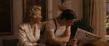 Movie still from “The Black Dahlia” (2006), directed by Brian De Palma – A man and a woman sitting at a table looking at a menu; Medium shot, Over the shoulder angle