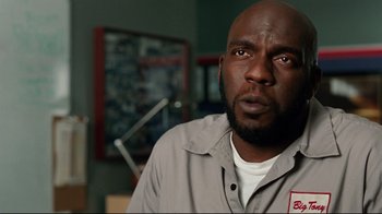 Movie still from “The Blind Side” (2009), directed by John Lee Hancock – A person wearing a gray shirt; Close Up shot, Low angle