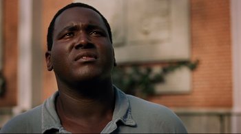 Movie still from “The Blind Side” (2009), directed by John Lee Hancock – A person looking up at the sky; Close Up shot, Low angle