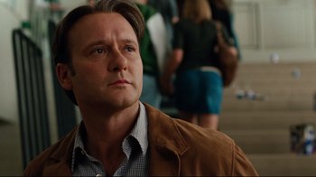 Movie still from “The Blind Side” (2009), directed by John Lee Hancock – A person wearing a brown jacket; Close Up shot, Low angle