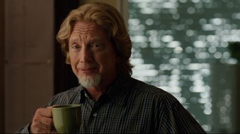 Movie still from “The Blind Side” (2009), directed by John Lee Hancock – An older man is holding a coffee cup; Close Up shot, Over the shoulder angle