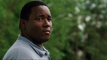 Movie still from “The Blind Side” (2009), directed by John Lee Hancock – A person looking at the camera; Close Up shot, Low angle