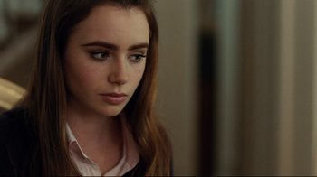 Movie still from “The Blind Side” (2009), directed by John Lee Hancock – A person with long brown hair; Close Up shot, Over the shoulder angle