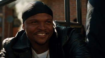 Movie still from “The Blind Side” (2009), directed by John Lee Hancock – A person wearing a hat; Close Up shot, Low angle