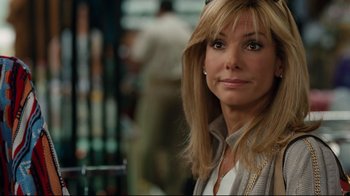 Movie still from “The Blind Side” (2009), directed by John Lee Hancock – A person with long hair; Close Up shot, Over the shoulder angle