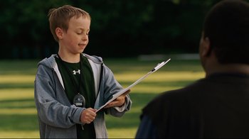Movie still from “The Blind Side” (2009), directed by John Lee Hancock – Medium shot, Over the shoulder angle