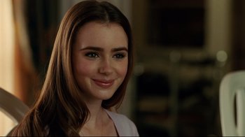 Movie still from “The Blind Side” (2009), directed by John Lee Hancock – A person with long brown hair; Close Up shot, Over the shoulder angle