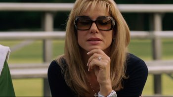 Movie still from “The Blind Side” (2009), directed by John Lee Hancock – A woman with sunglasses and a ring on her finger; Close Up shot, Low angle