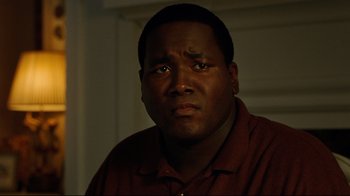 Movie still from “The Blind Side” (2009), directed by John Lee Hancock – A person wearing a red shirt; Close Up shot, High angle