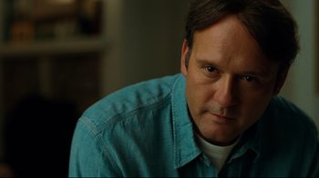 Movie still from “The Blind Side” (2009), directed by John Lee Hancock – A person wearing a blue shirt; Close Up shot, Low angle