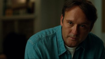Movie still from “The Blind Side” (2009), directed by John Lee Hancock – A person wearing a blue shirt; Close Up shot, Low angle