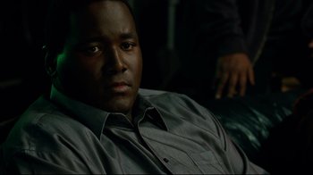 Movie still from “The Blind Side” (2009), directed by John Lee Hancock – A person sitting on a couch; Close Up shot, High angle