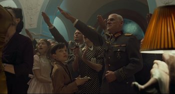 Movie still from “The Boy in the Striped Pajamas” (2008), directed by Mark Herman – A group of people standing around each other; Medium shot, Low angle