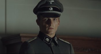 Movie still from “The Boy in the Striped Pajamas” (2008), directed by Mark Herman – A man in a military uniform is wearing a hat; Close Up shot, Low angle