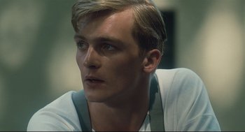 Movie still from “The Boy in the Striped Pajamas” (2008), directed by Mark Herman – A person wearing a white shirt; Close Up shot, Low angle