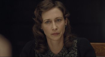 Movie still from “The Boy in the Striped Pajamas” (2008), directed by Mark Herman – A person wearing a dress; Close Up shot, High angle