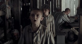 Movie still from “The Boy in the Striped Pajamas” (2008), directed by Mark Herman – Two young boys are standing in a room; Medium shot, Over the shoulder angle