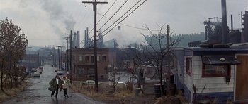 Movie still from “The Deer Hunter” (1978), directed by Michael Cimino – An industrial area with power lines and power poles; Extreme Wide shot, High angle