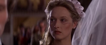Movie still from “The Deer Hunter” (1978), directed by Michael Cimino – A person with long blonde hair; Close Up shot, Over the shoulder angle